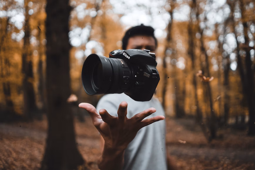Man throwing a camera